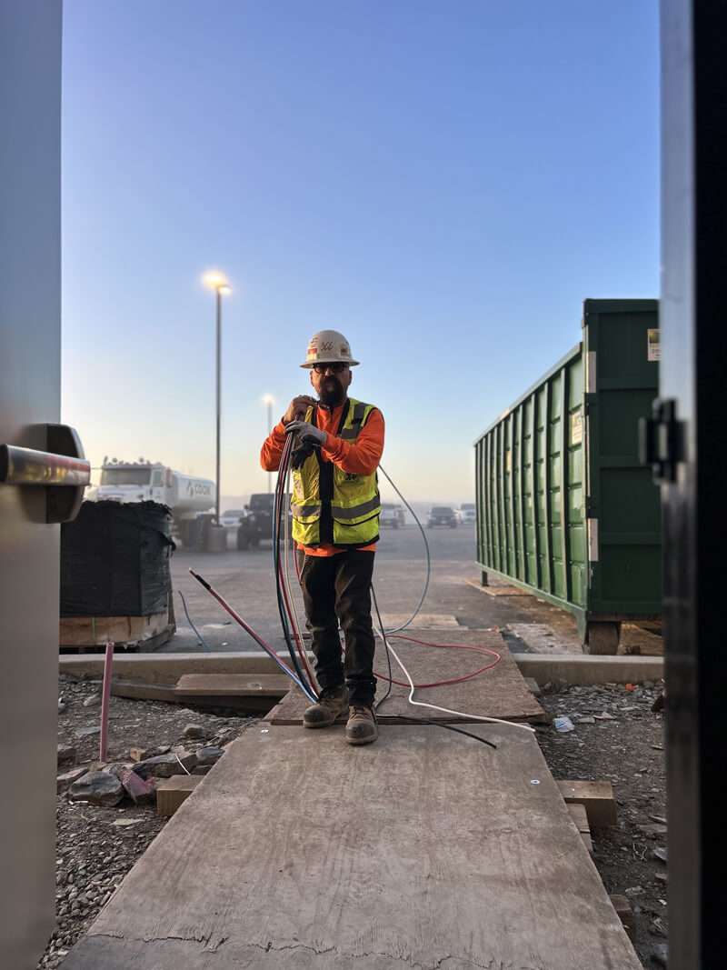 Job site crew member at dusk